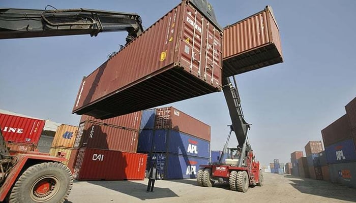 Cranes picking up containers at a port. — Reuters/File