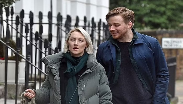 Jack Lowden and girlfriend Saoirse Ronan look loved-up as they head out for stroll in the cold