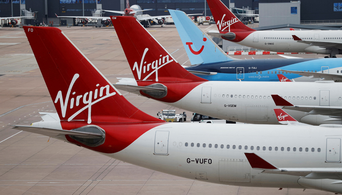 Virgin Atlantic and TUI Airways aircraft are seen at Manchester Airport, following the outbreak of the coronavirus disease (COVID-19), Manchester, Britain, June 8, 2020. — Reuters