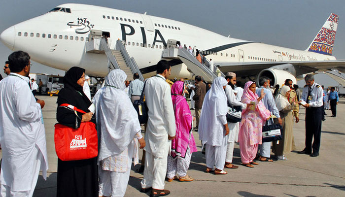 Passengers are standing in queue to board a PIA plane.  — APP/File
