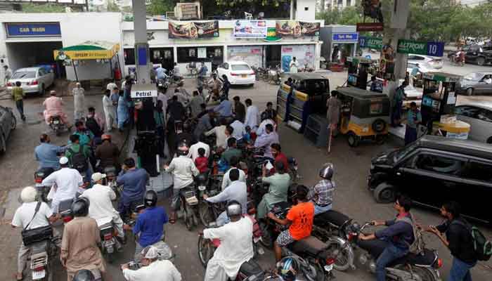 Customers gather to buy petrol at a petrol station in Karachi, Pakistan July 26, 2017. — Reuters/File