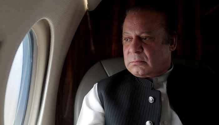 Former prime minister Nawaz Sharif looks out of the window of his plane after attending a ceremony to inaugurate the M9 motorway between Karachi and Hyderabad, Pakistan in February 3, 2017. — Reuters/File