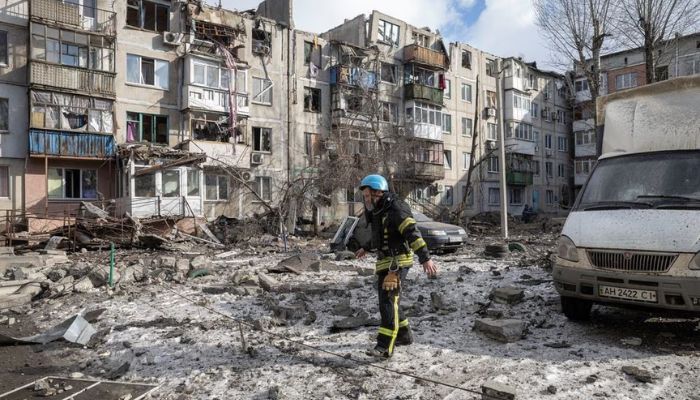 A firefighter walks at a car park near an apartment block that was heavily damaged by a missile strike, amid Russias attack on Ukraine, in Pokrovsk, Donetsk region, Ukraine, February 15, 2023.— Reuters