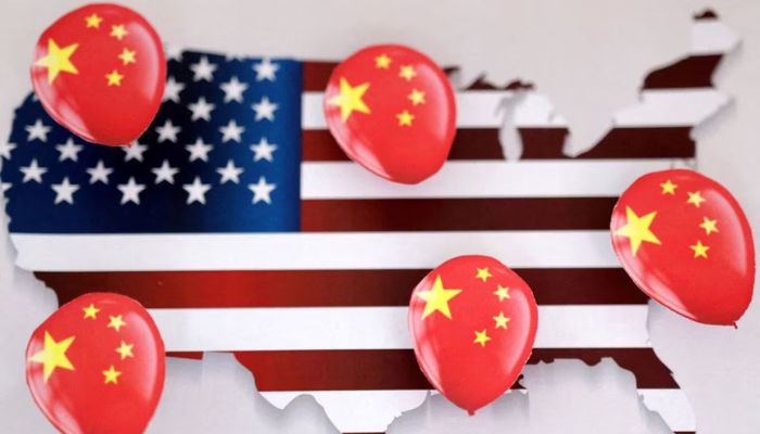 Printed balloons with Chinese flag are placed on US flag in the shape of US map outline, in this illustration taken February 5, 2023.— Reuters