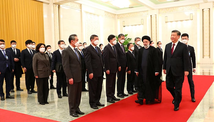 Iranian President Ebrahim Raisi walks with Chinese President Xi Jinping during a welcoming ceremony in Beijing, China, February 14, 2023. — Reuters