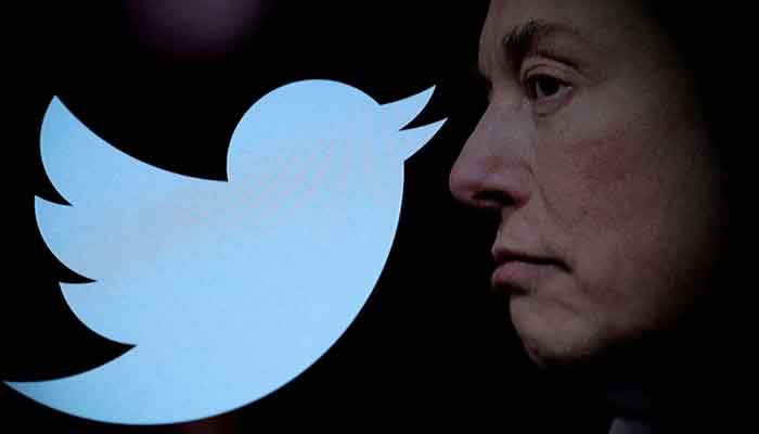 Twitter logo and a photo of Elon Musk are displayed through magnifier in this illustration taken October 27, 2022. — Reuters