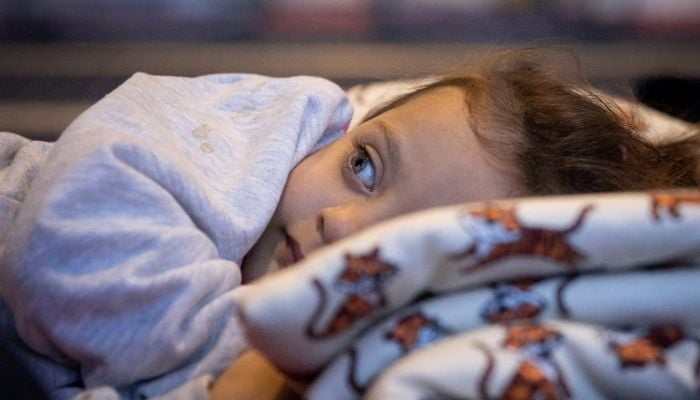 A child rests in a ferry turned into a makeshift healthcare facility for victims of the deadly earthquake in Iskenderun, Hatay province, Turkey, February 15, 2023.— Reuters