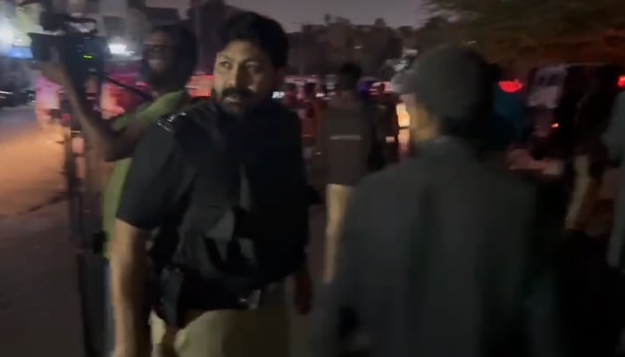 Police officers outside the Karachi police head office, on February 17, 2023, in this still taken from a video. — Geo.tv via Afzal Nadeem Dogar