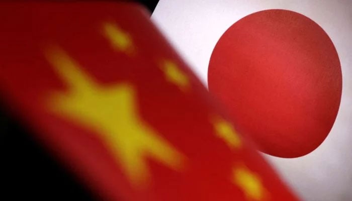 Printed Chinese and Japanese flags are seen in this illustration, July 21, 2022.— REUTERS/Dado