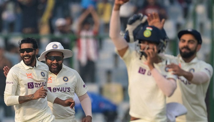 Indias Ravindra Jadeja (L) celebrates with teammates after the dismissal of Australias Usman Khawaja (not pictured) during the second day of the second Test cricket match between India and Australia at the Arun Jaitley Stadium in New Delhi on February 18, 2023. — AFP