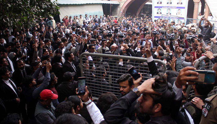 A large numbers of supporters gathered outside Lahore High Court on the arrival of PTI chief Imran Khan for hearing on his bail application in Lahore on Monday, February 20, 2023. — PPI