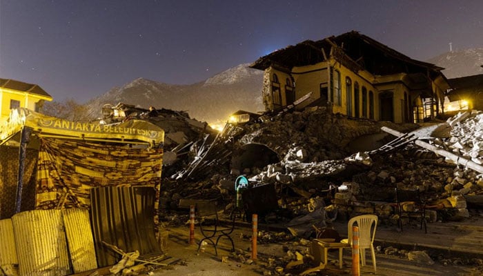 Destroyed buildings are seen at night in the aftermath of a deadly earthquake in Antakya, Turkey on February 19, 2023. — Reuters