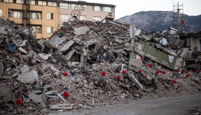 Red balloons attached to parts of a destroyed apartment building are seen in Antakya, Turkey February 19, 2023. — Reuters