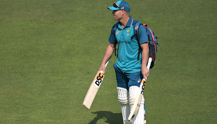 Australias David Warner arrives to attend a practice session at the Arun Jaitley Stadium in New Delhi on February 15, 2023. — AFP