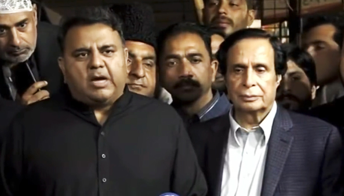 PTI Senior Vice President Fawad Chaudhry (left) addresses a press conference in Lahore alongside former PML-Q leader Parvez Elahi on February 21, 2023 in this still taken from a video. — Twitter/@PTIofficial