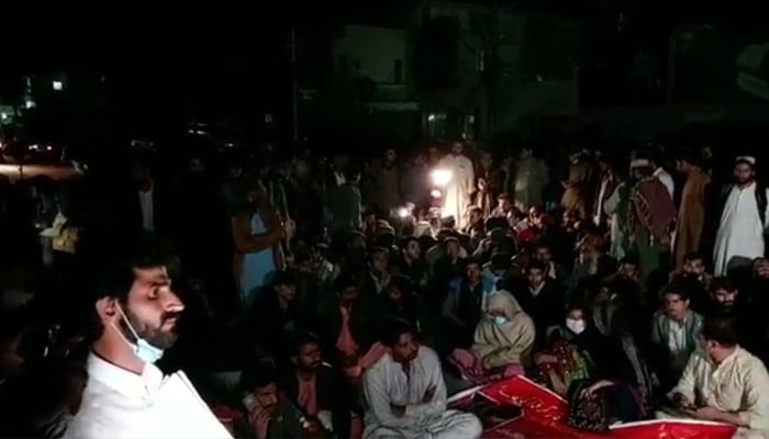 Tribal members stage a sit-in outside the Chief Minister house in Quetta, against the murder of a woman and her two children in Barkhan on February 21, 2023. — Twitter/leokhanasim