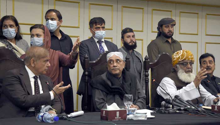PDM leaders Maulana Fazal-ur-Rehman (right) talking with media persons along with Asif Ali Zardari (centre) and Shahbaz Shraif (left) in Islamabad on March 8, 2022. — Online
