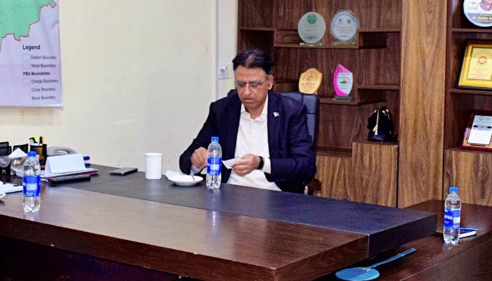 PTI leader Asad Umar in a meeting with party leaders on February 15, 2023. Twitter/Dr_YasminRashid
