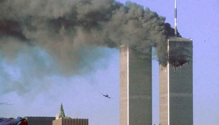 United Airlines Flight 175 flies low toward the South Tower of the World Trade Center, shortly before slamming into the structure in New York City, on September 11, 2001. — Reuters