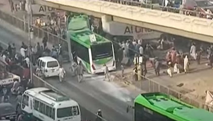 A screengrab shows a green line bus standing off the track. — Geo News