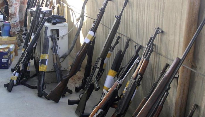 Weapons recovered during a raid by paramilitary forces are displayed for the media in Karachi, on March 11, 2015. — Reuters