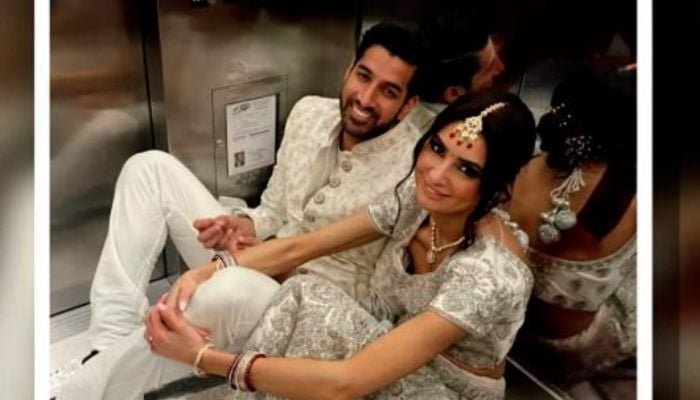 Screengrab shows Panav Jha and Victoria Jha trapped in the elevator.— CNN video