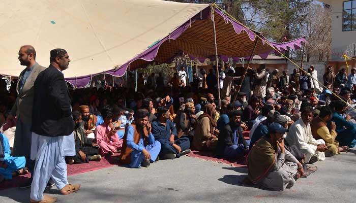 Khan Muhammad Marris relatives stage a sit-in against the killing of his children in Kohlu, outside the CM House in Quetta on February 22, 2023. — INP