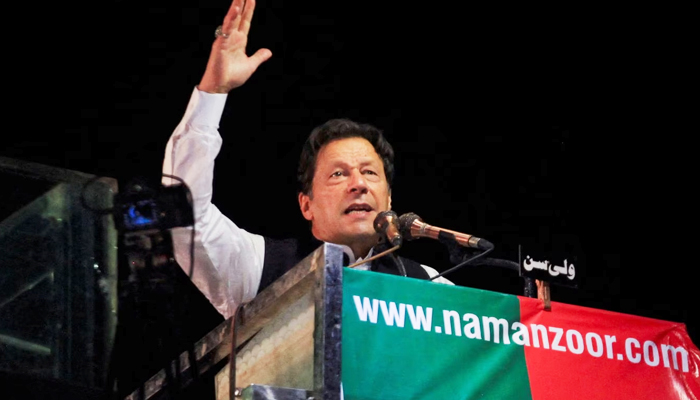PTI Chairman Imran Khan gestures as he addresses supporters during a rally, in Lahore, on April 21, 2022. — Reuters