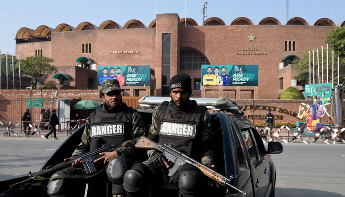 Security personnel stand guard ahead of the PSL match, outside Gaddafi Stadium in Lahore. — AFP/File