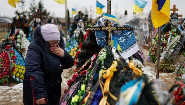 Mariia reacts near the grave of her son Vasyl Kurbet, Ukrainian service member killed in a fight against Russian troops, on a day of the first anniversary of Russias attack on Ukraine, at a cemetery in the town of Bucha, outside Kyiv, Ukraine February 24, 2023.— Reuters