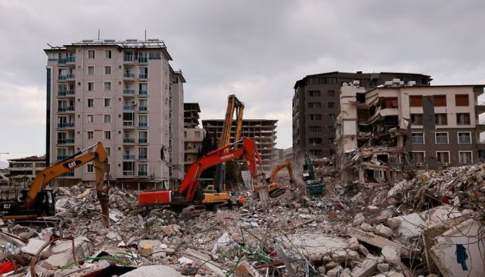 Workers clean the rubble of a collapsed building in the aftermath of a deadly earthquake in Antakya, Hatay province, Turkey, February 21, 2023.— Reuters