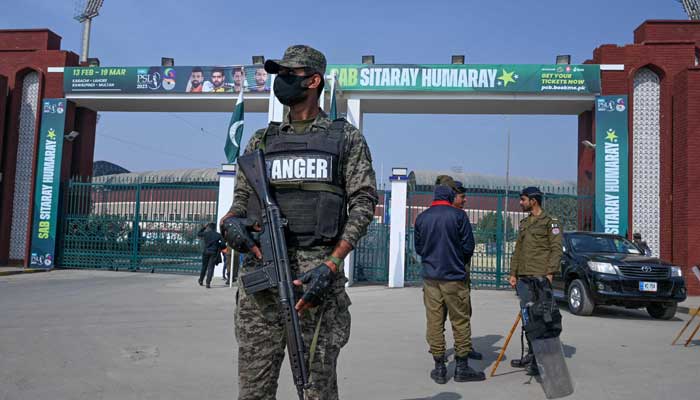A Pakistans ranger (centre) stands guard in front of the Multan Cricket Stadium before the start of Pakistan Super League T20 cricket match between Multan Sultans and Islamabad United in Multan on February 19, 2023. — AFP