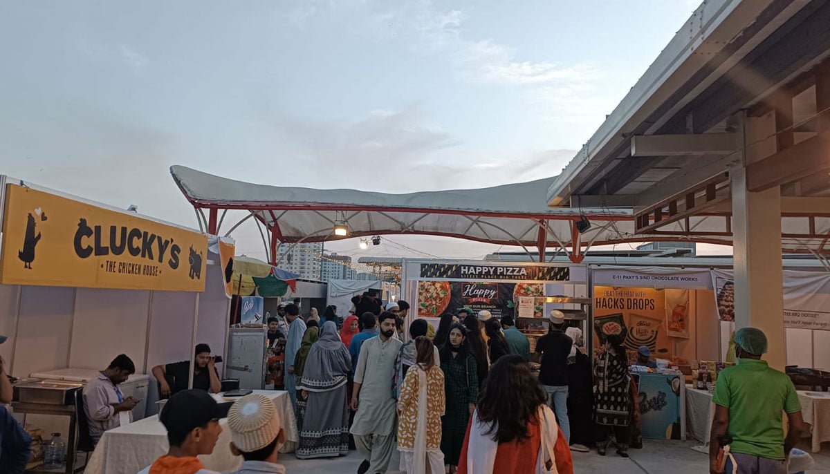 People visiting food stalls at Bohra Food Festival. — By the author