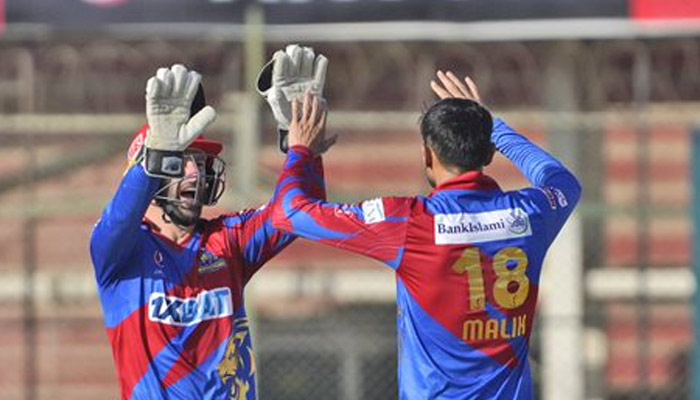 Karachi Kings players celebrate during the 14th match of the eighth edition of the Pakistan Super League played in the National Bank Cricket Arena in Karachi on February 26, 2023. — PSL