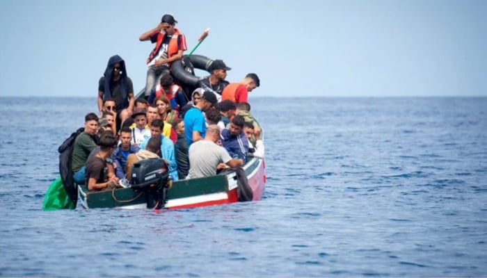 A boat carrying migrants is stranded in the Strait of Gibraltar before being rescued by the Spanish Guardia Civil. — AFP/File