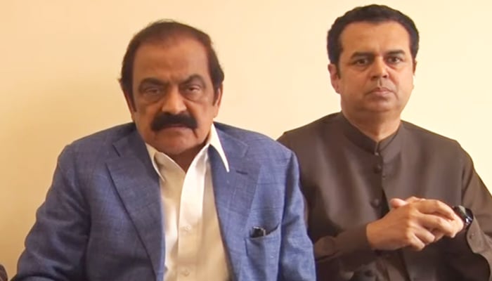 Interior Minister Rana Sanaullah addresses a presser, flanked by PML-N leader Talal Chaudhry on his right, in Sahiwal on February 28, 2023, in this still taken from a video. — YouTube/Hum News Live