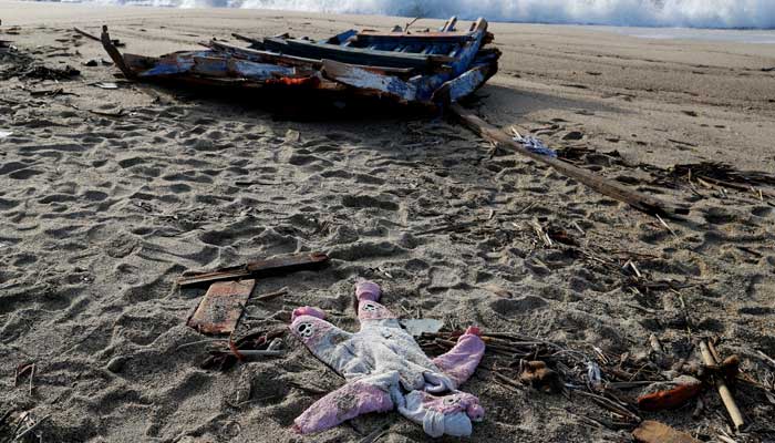 A piece of the boat and a piece of clothing from the deadly migrant shipwreck are seen in Steccato di Cutro near Crotone, Italy, February 28, 2023. — Reuters