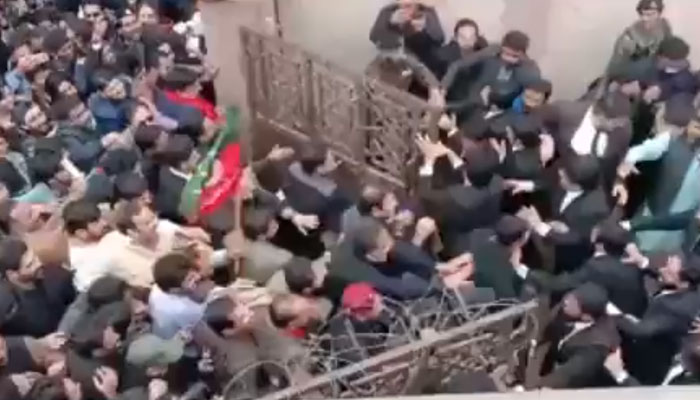 PTI’s supporters enter the judicial complex in Islamabad, on February 28, 2023, in this still taken from a video. — Twitter/ SabeeKazmi786