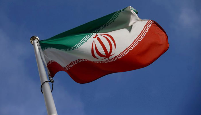 The Iranian flag waves in front of the International Atomic Energy Agency (IAEA) headquarters, before the beginning of a board of governors meeting, in Vienna, Austria, March 1, 2021. REUTERS/File