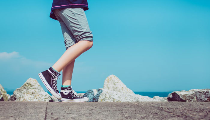 Daily exercise such as a brisk walk can protect you from serious health hazards that may lead to early death.  Representational image by Unsplash