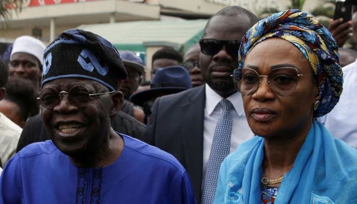 Presidential candidate Bola Ahmed Tinubu arrives with his wife Oluremi Tinubu at a polling station before casting his ballot in Ikeja, Lagos, Nigeria February 25, 2023.— Reuters