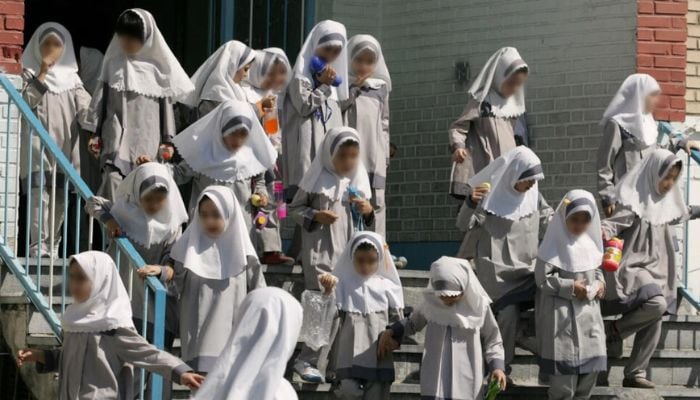 Iranian schoolgirls are pictured in the capital Tehran.— AFP/file