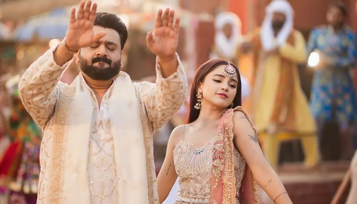 Pakistani singers Aima Baig (Left) and Sahir Ali Bagga dance on the beats of theri new song Washmallay in this still image taken during the shoot of the music video. — Instagram/@farhal_photography