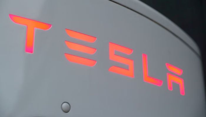 The logo of Tesla is seen at a Tesla Supercharger station October 21, 2020.— Reuters