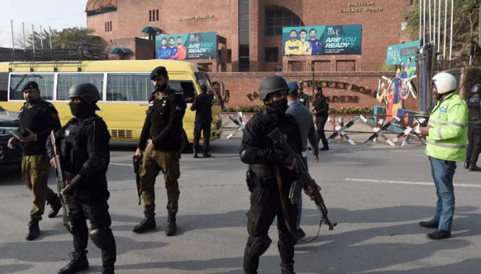 Security personnel stand guard during a PSL match in Lahore. — APP/File