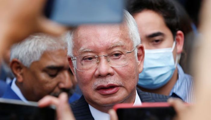 Former Malaysian Prime Minister Najib Razak speaks to journalists outside the Federal Court during a court break, in Putrajaya, Malaysia August 23, 2022.— Reuters