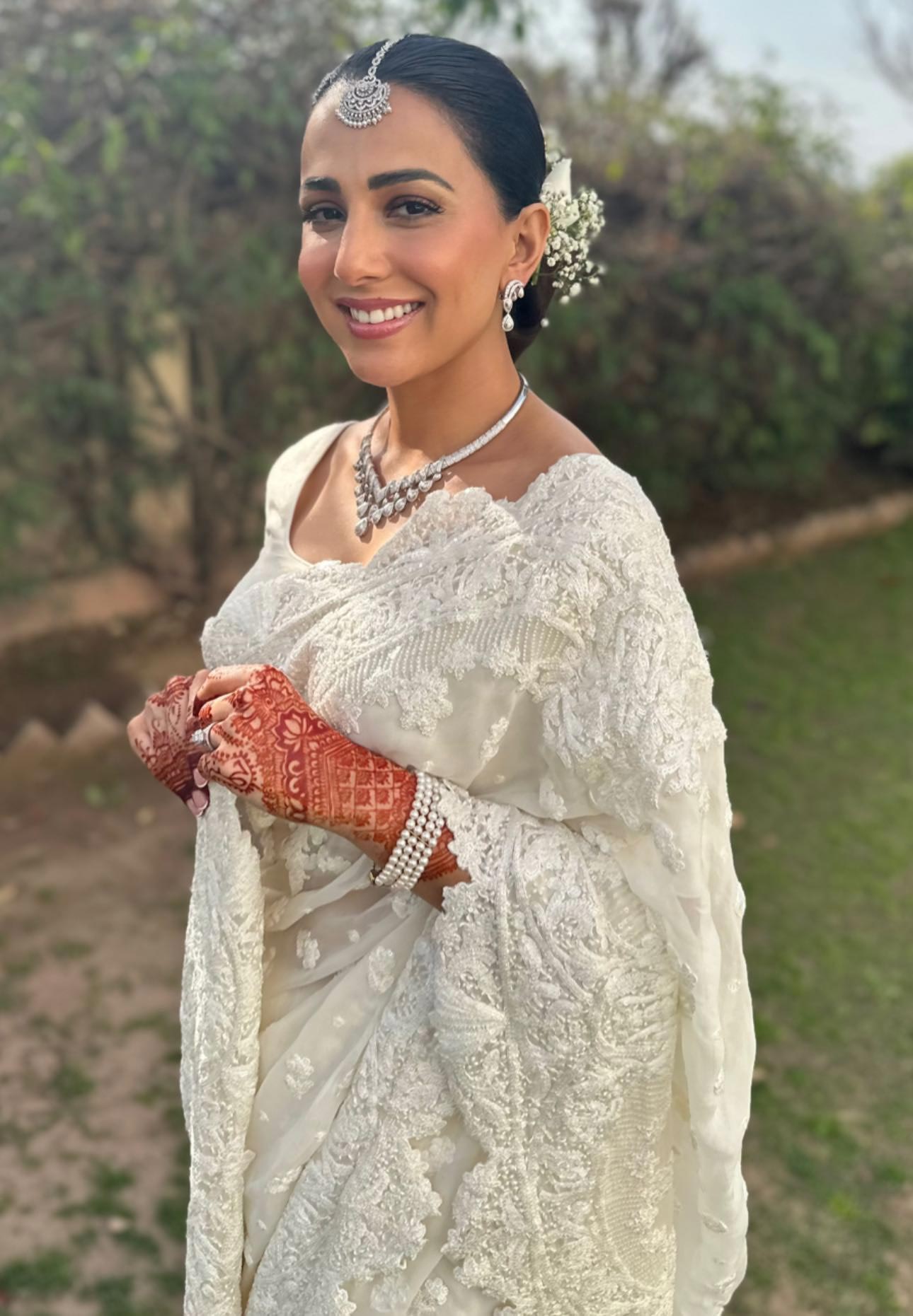 Pakistan actor Ushna Shah looks ethereal in a white lace saree that she paired with a luxurious white blouse. — Instagram/hamza.amin87