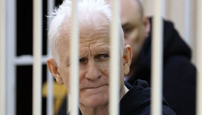 In this file photo taken on January 05, 2023, Nobel Prize winner Ales Bialiatski is seen in the defendants’ cage in the courtroom at the start of the hearing in Minsk. — AFP