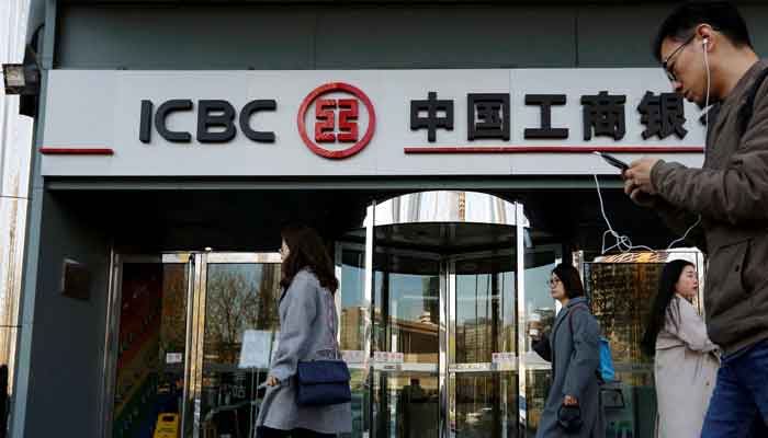 People walk past a branch of Industrial and Commercial Bank of China (ICBC) in Beijing, China April 1, 2019. Picture taken April 1, 2019. — Reuters