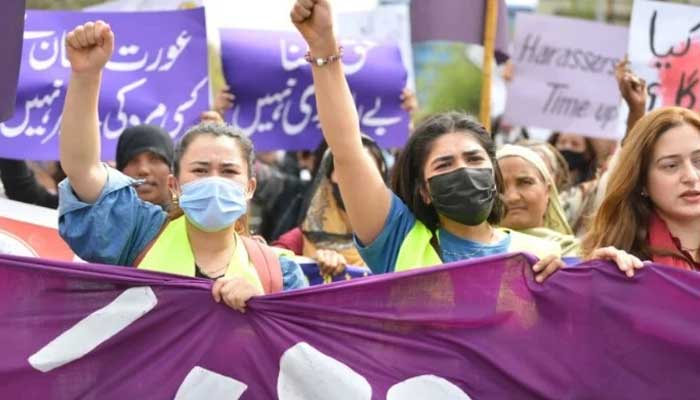 Aurat March protesters hold placards and shout slogans as they gather to mark International Womens Day in Islamabad — Farooq Naeem/ AFP